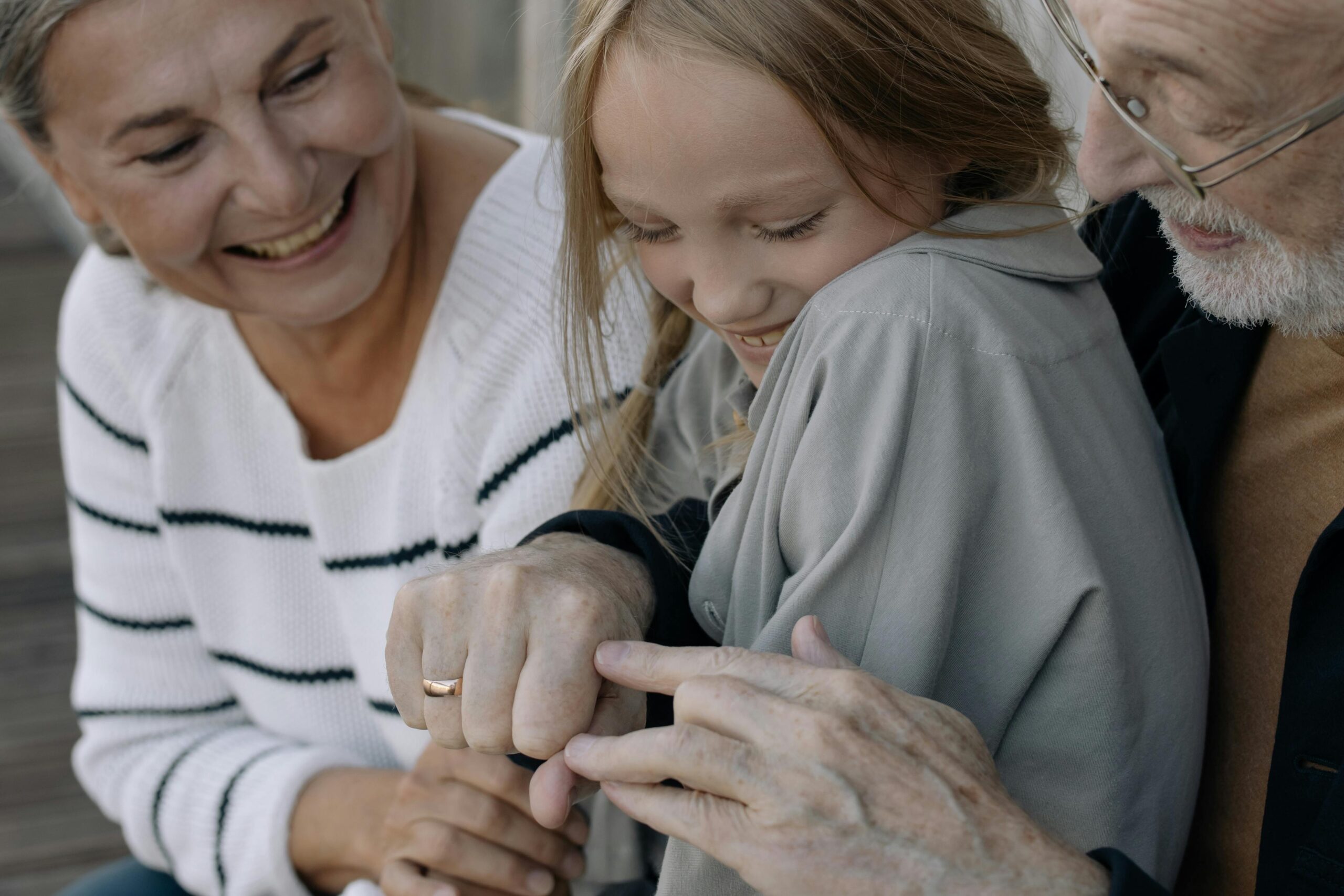 grandparents and grandchildren hugging each other before dental visit because our dentist near Eastfield NC believes that preventative dentistry is important for patients of all ages