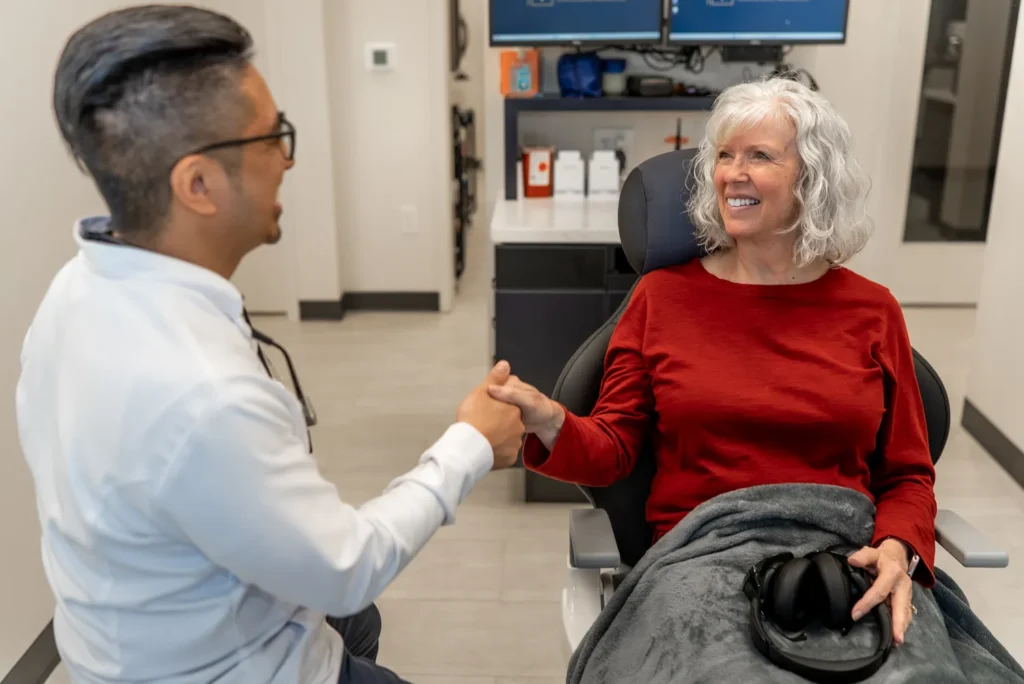 Dr. V shaking hands with a patient