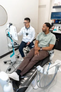 Dr. V with a patient in the dental office