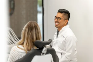 Dr. Viloria smiling with a patient